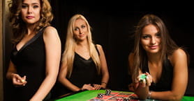 Das Bild zeigt mehrere professionelle Dealer des Live Casinos.